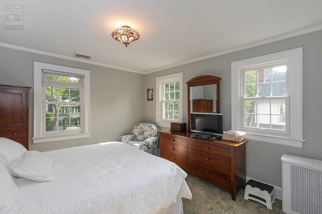 bedroom with three windows
