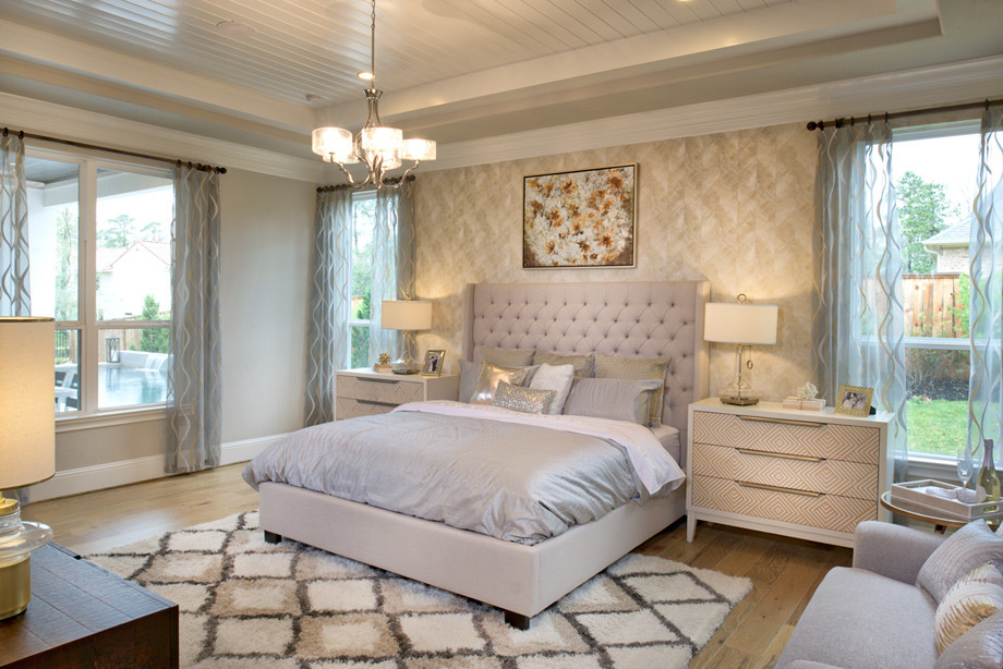 Master Bedroom with wallpapered back wall. Transitional Bedroom