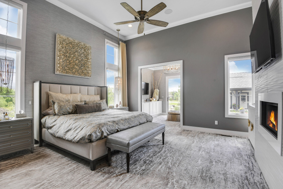 Photo of a traditional master bedroom in Kansas City with grey walls, carpet, a standard fireplace and grey floors.