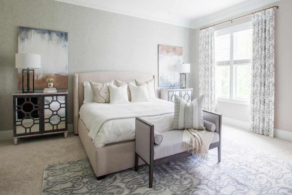 This is an example of a traditional bedroom in Charlotte with grey walls and carpet.