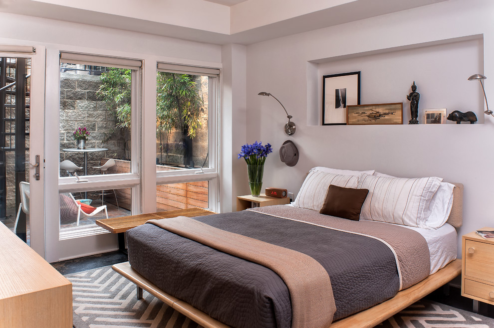 Mid-sized trendy concrete floor and gray floor bedroom photo in DC Metro with gray walls and no fireplace
