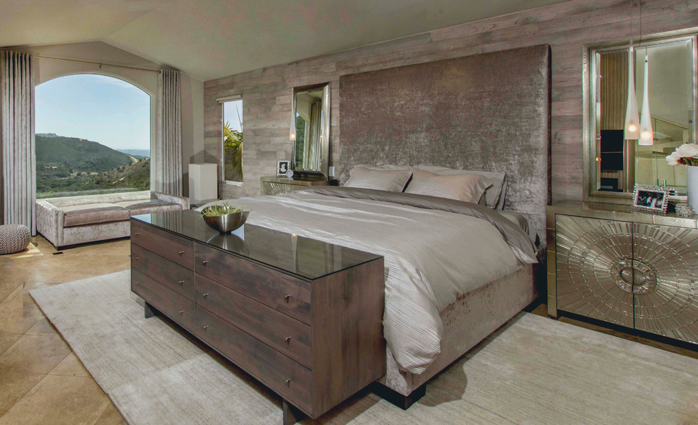 Inspiration for a large contemporary master limestone floor bedroom remodel in San Diego with gray walls