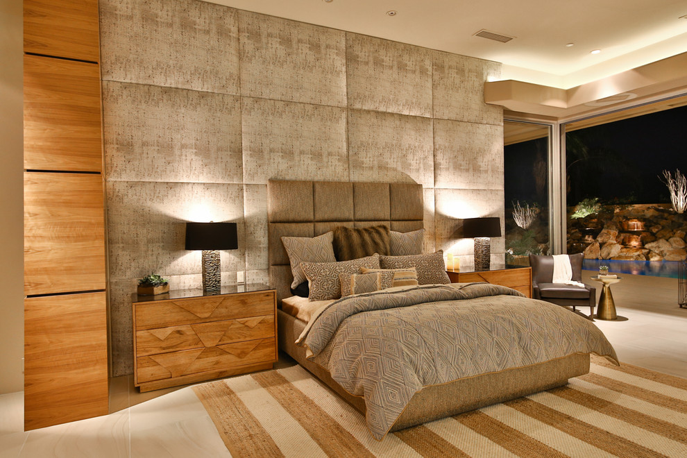 This is an example of an expansive contemporary master bedroom in Los Angeles with beige walls, porcelain flooring, no fireplace and beige floors.