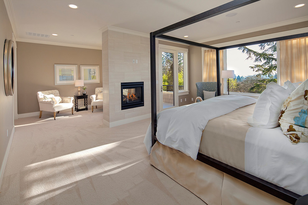 Trendy master carpeted bedroom photo in Seattle with multicolored walls, a two-sided fireplace and a tile fireplace