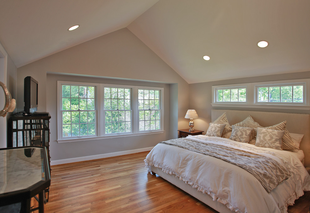 Photo of a traditional master bedroom in DC Metro with medium hardwood flooring and no fireplace.