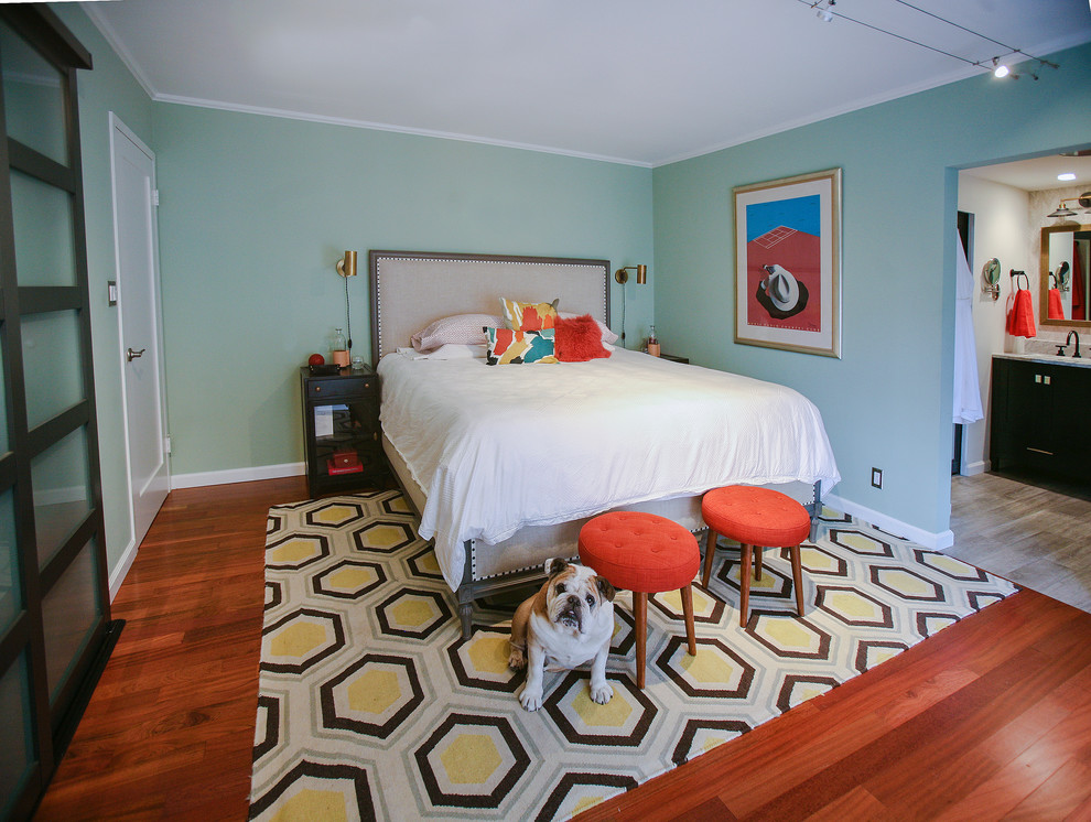 Medium sized eclectic master bedroom in San Francisco with green walls, medium hardwood flooring and no fireplace.