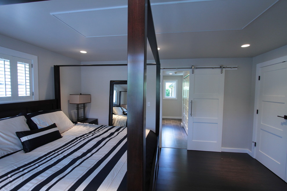 Design ideas for a medium sized modern master bedroom in Seattle with grey walls and dark hardwood flooring.