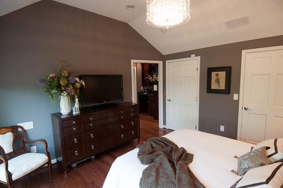Small elegant master medium tone wood floor bedroom photo in Cincinnati with gray walls and no fireplace
