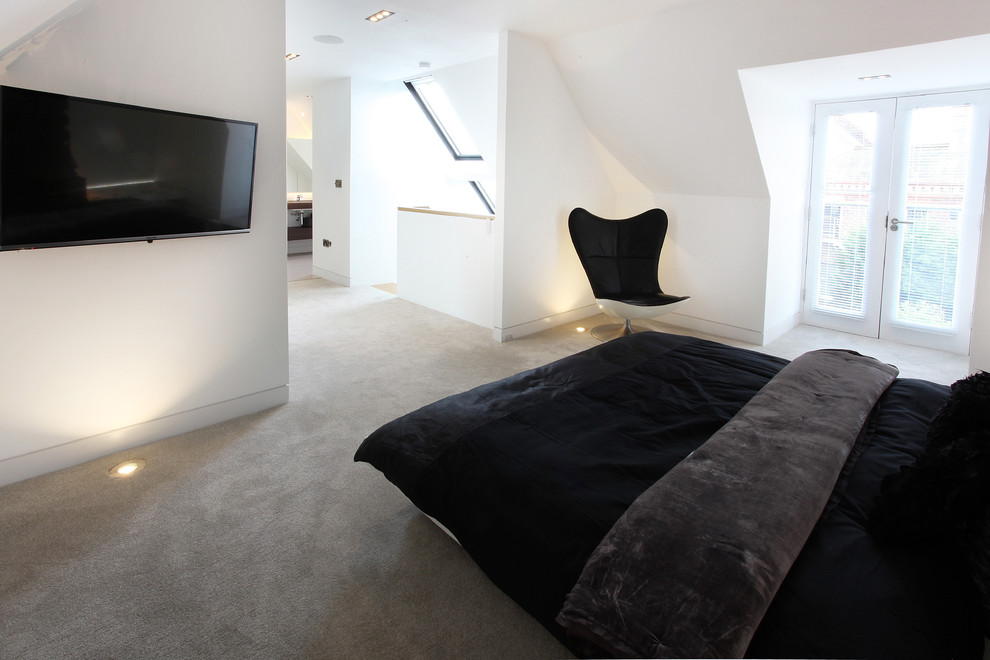 Inspiration for a medium sized contemporary master bedroom in Manchester with white walls and carpet.