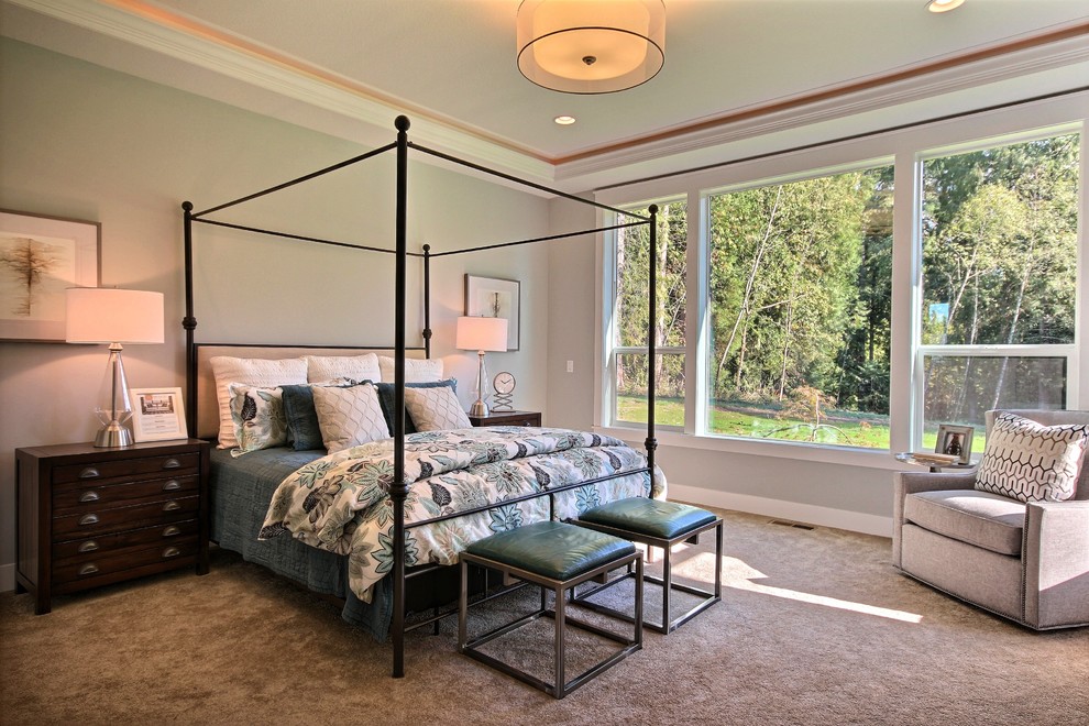 Example of a huge transitional master carpeted bedroom design in Portland with gray walls