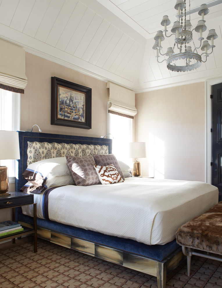 Large modern guest bedroom in Jacksonville with beige walls, dark hardwood flooring and brown floors.