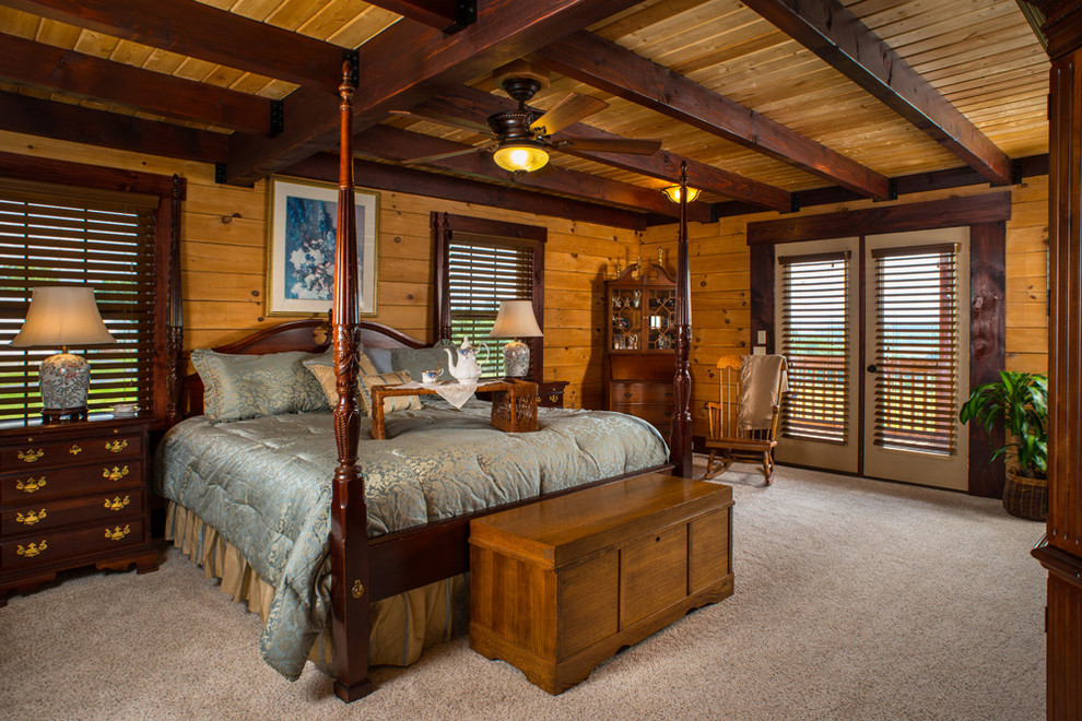 Example of a large mountain style master carpeted bedroom design in Huntington with multicolored walls and no fireplace
