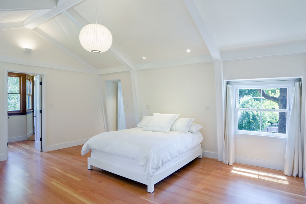 Bedroom - shabby-chic style medium tone wood floor bedroom idea in San Francisco with beige walls