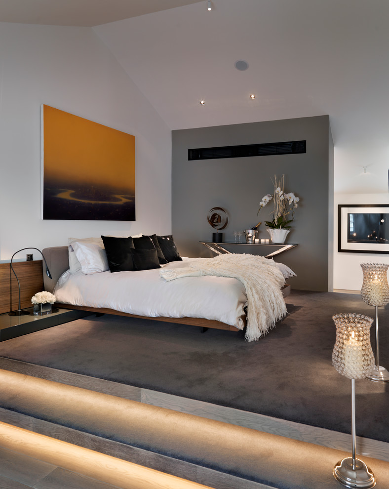 Photo of a contemporary bedroom in Other with feature lighting.