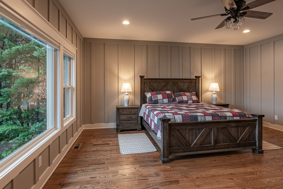 Photo of a large rustic master bedroom in Atlanta with beige walls.