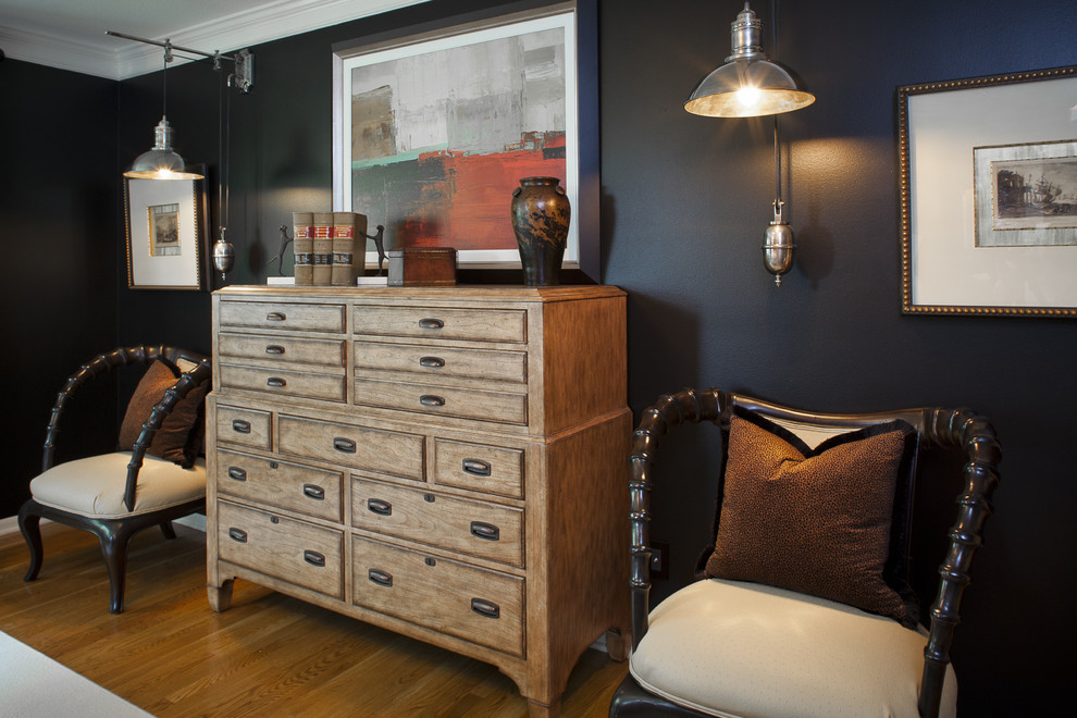 Mountain style medium tone wood floor bedroom photo in Kansas City with black walls