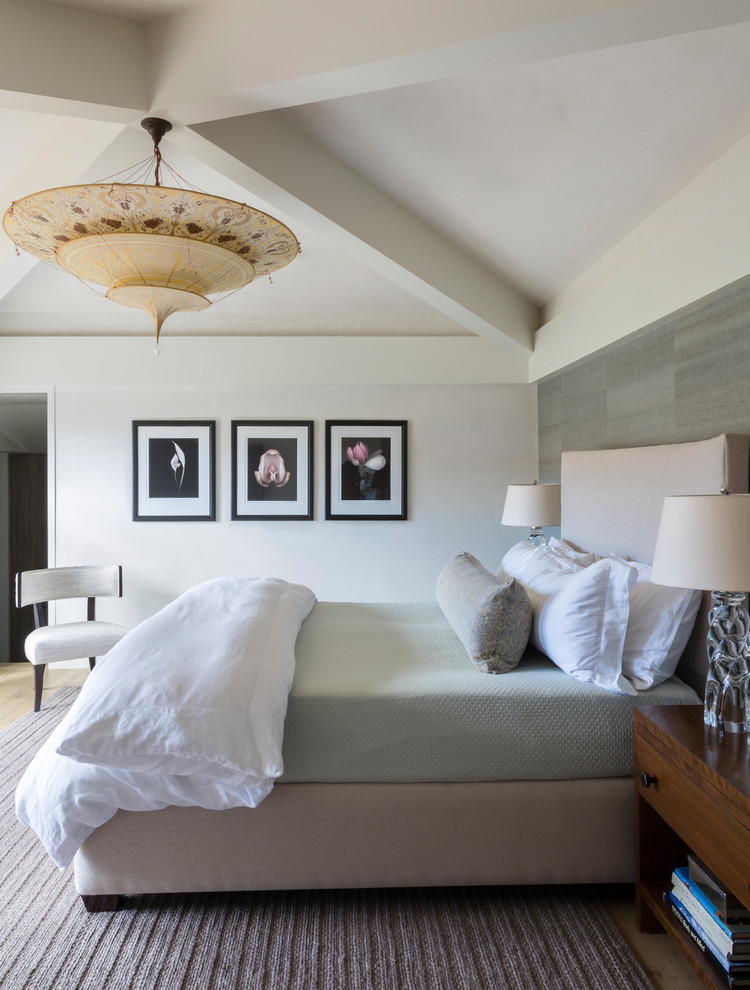 Contemporary master bedroom in Denver with beige walls.