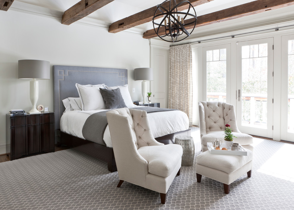 Example of a transitional master bedroom design in DC Metro with white walls