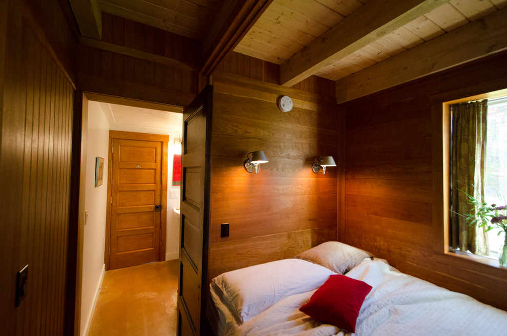Esempio di una piccola camera da letto stile loft minimalista con pareti bianche