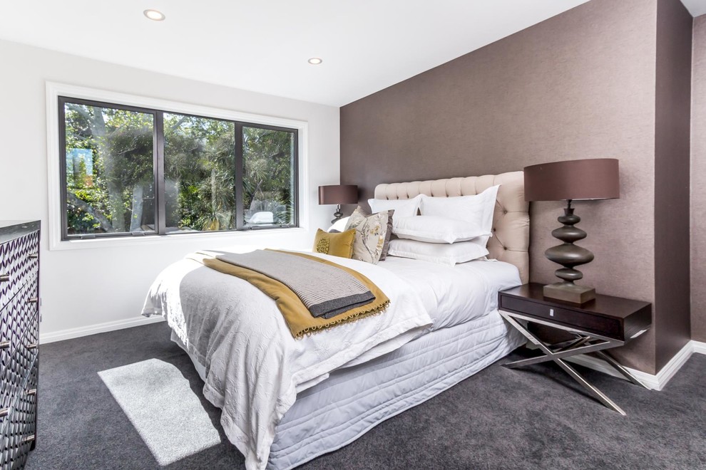 Inspiration for a medium sized contemporary master bedroom in Auckland with brown walls and carpet.