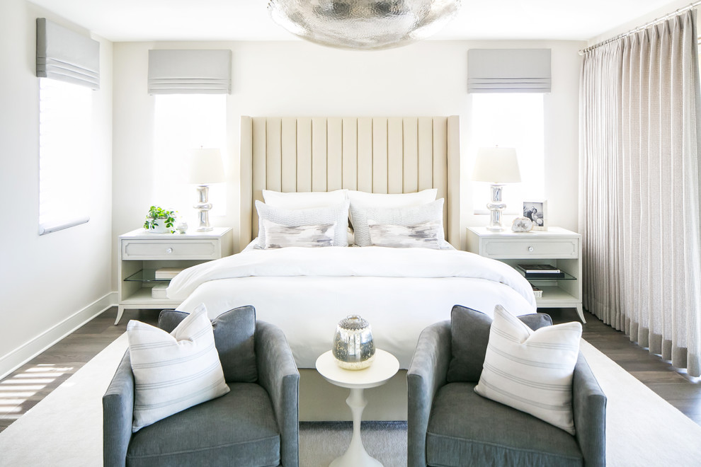 Contemporary master bedroom in San Diego with medium hardwood flooring and grey walls.