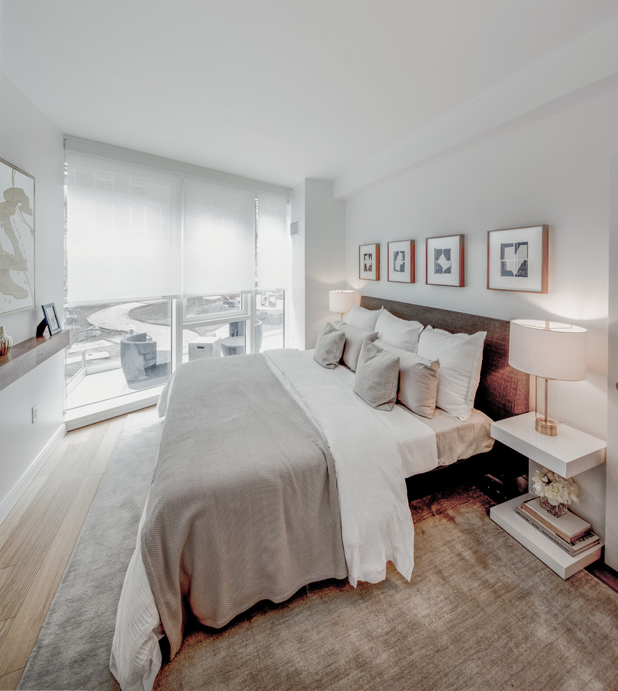 Trendy guest dark wood floor and brown floor bedroom photo in Chicago with blue walls