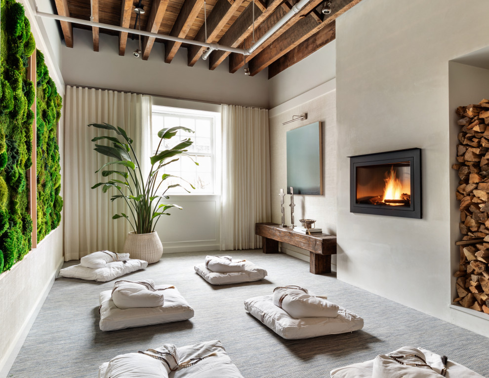 Example of a mid-sized trendy guest carpeted and blue floor bedroom design in New York with white walls