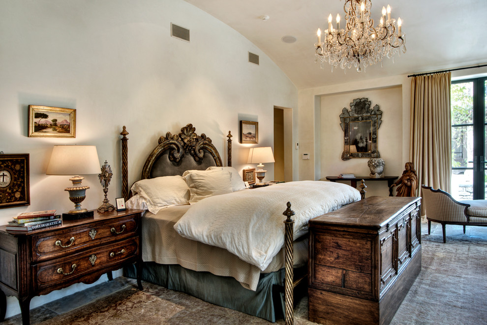 This is an example of a mediterranean bedroom in Houston with beige walls.