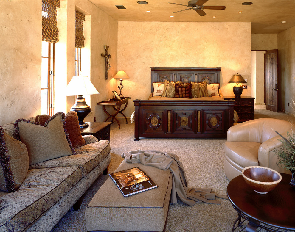 Tuscan master carpeted bedroom photo in Atlanta with beige walls