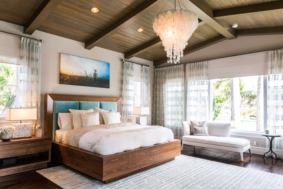Photo of a traditional guest bedroom in Miami with white walls, dark hardwood flooring and brown floors.