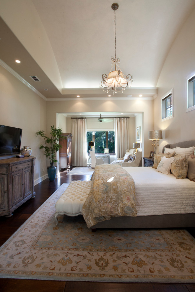 Bedroom - large mediterranean master dark wood floor and brown floor bedroom idea in Austin with beige walls and no fireplace