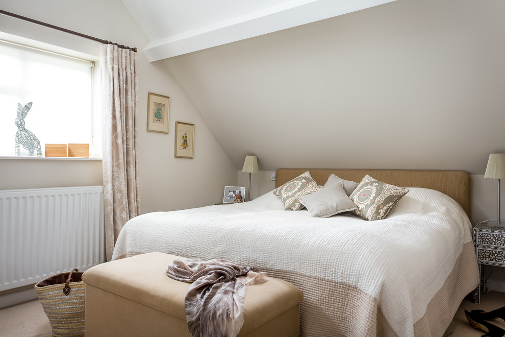 Photo of a medium sized country master bedroom in Gloucestershire with carpet, beige walls and beige floors.