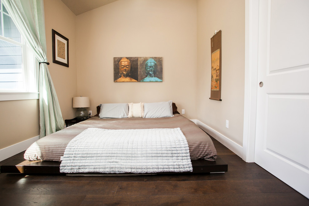 Bedroom - small guest dark wood floor and brown floor bedroom idea in Portland with beige walls and no fireplace