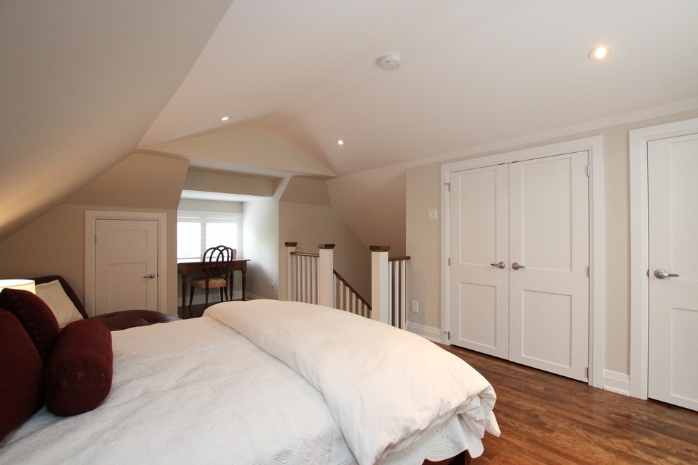 Example of a mid-sized transitional loft-style dark wood floor and brown floor bedroom design in Other with beige walls