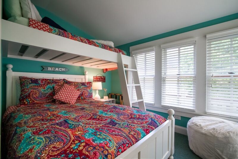 This is an example of a medium sized nautical guest bedroom in Philadelphia with blue walls.