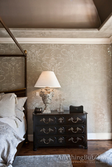 Inspiration for a large master medium tone wood floor bedroom remodel in Houston with gray walls