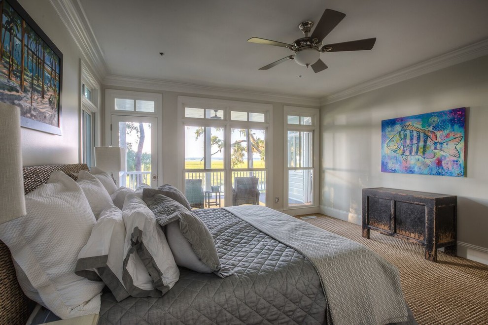 Large coastal master bedroom in Atlanta with grey walls, carpet, no fireplace and beige floors.
