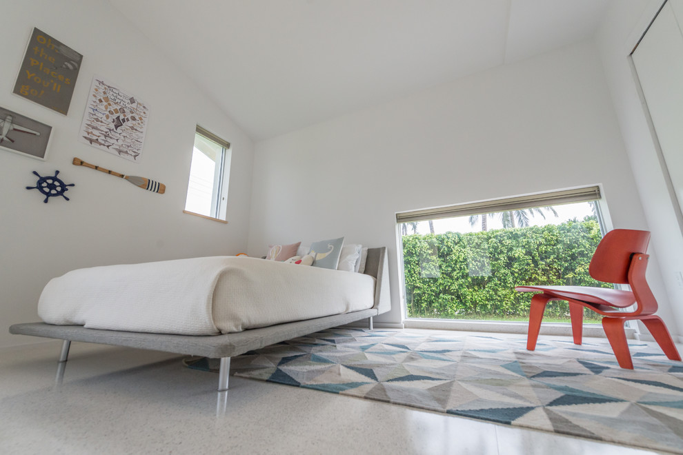 Example of a mid-sized minimalist guest linoleum floor and gray floor bedroom design in Miami with white walls and no fireplace