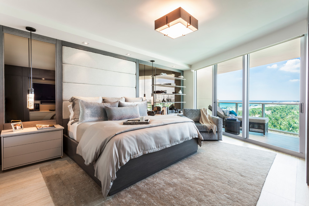 This is an example of a contemporary grey and cream bedroom in Miami.