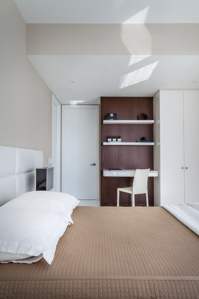 Inspiration for a mid-sized contemporary master white floor bedroom remodel in Miami with beige walls and no fireplace