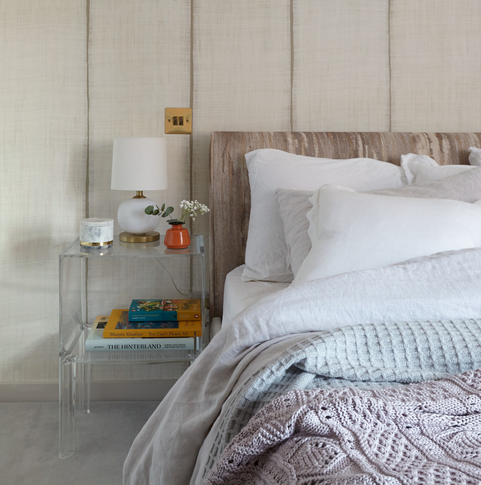 Inspiration for a small mid-century modern master carpeted bedroom remodel in London with beige walls