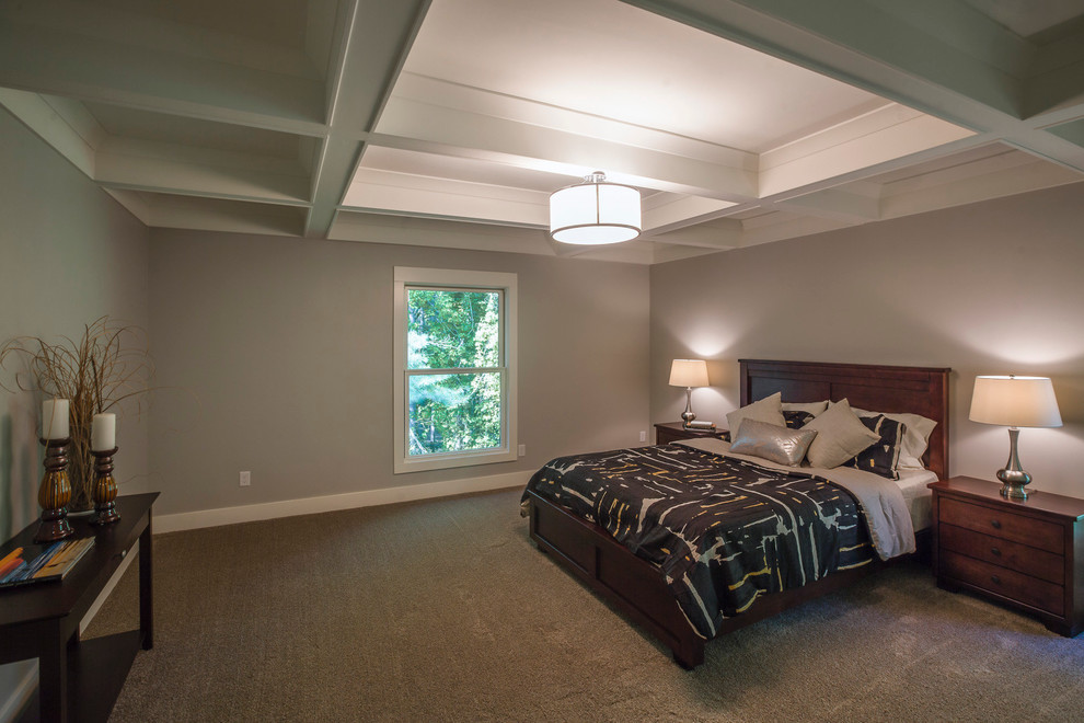 This is an example of a midcentury bedroom in Grand Rapids with grey walls and carpet.