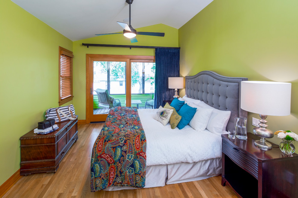 Inspiration for a classic master bedroom in Austin with green walls, medium hardwood flooring and brown floors.