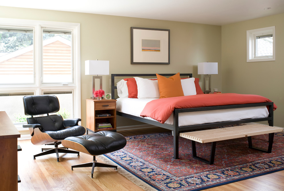 Example of a trendy master light wood floor bedroom design in Denver with green walls