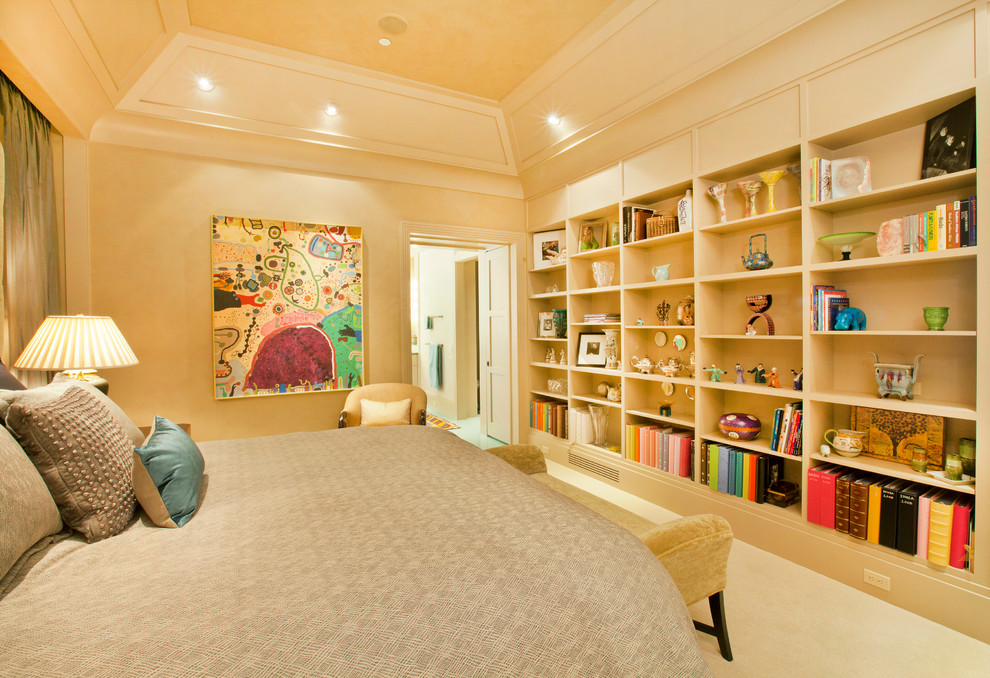 Example of a large transitional master carpeted bedroom design in Omaha with beige walls