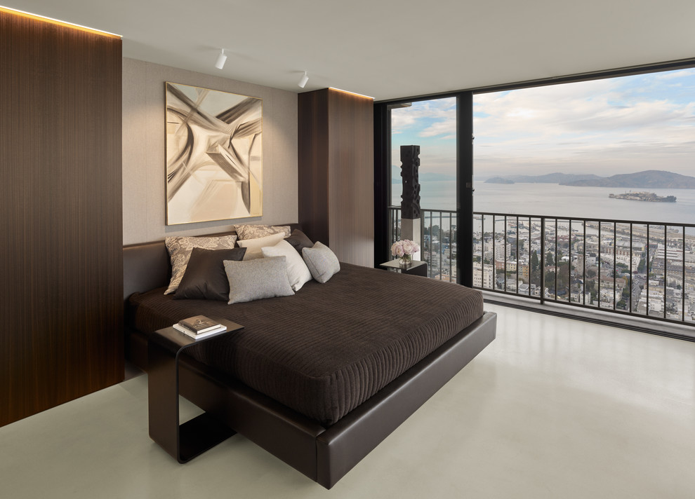 Kleines Modernes Schlafzimmer ohne Kamin mit grauer Wandfarbe und Betonboden in San Francisco