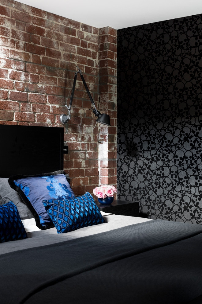 Example of a mid-sized urban loft-style carpeted bedroom design in Melbourne with black walls