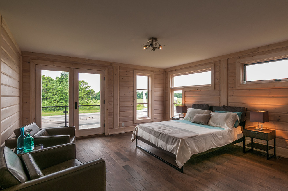 Idee per una camera matrimoniale design di medie dimensioni con pavimento in legno massello medio