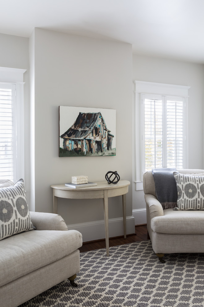 Inspiration for a large transitional master medium tone wood floor and brown floor bedroom remodel with beige walls and no fireplace