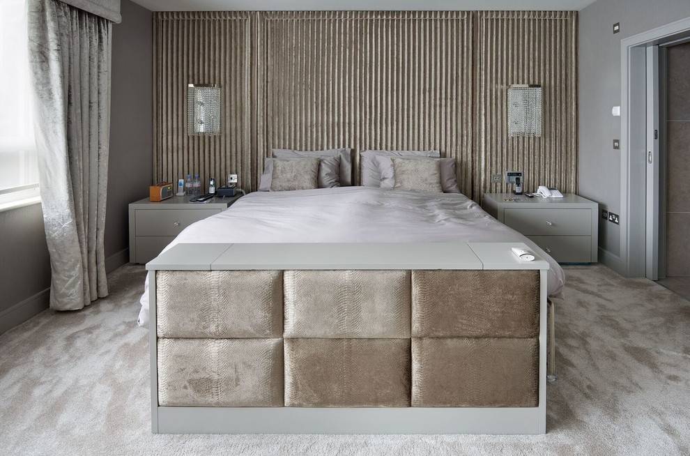 This is an example of a contemporary grey and silver bedroom in Hertfordshire.